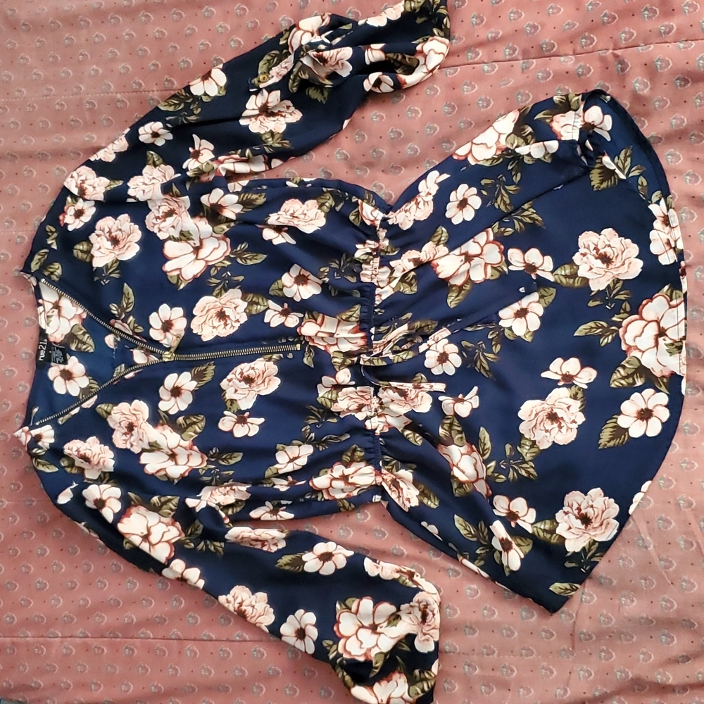 A blue top with pink flowers